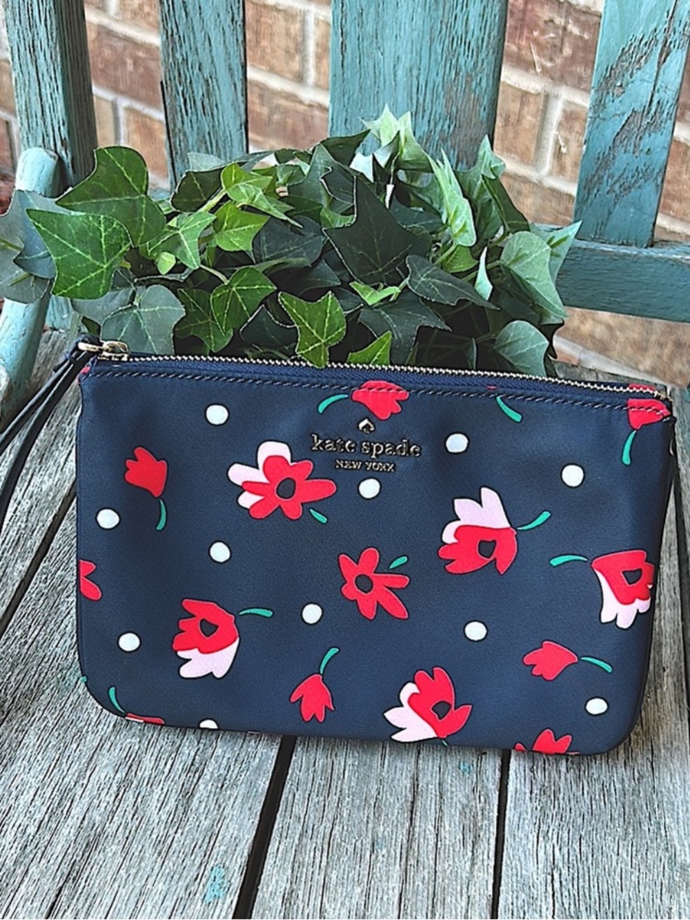 Kate Spade Chelsea Whimsey Floral Navy  Wristlet Pouch with red and pink blooms